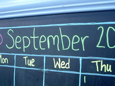 Use chalk markers to draw your calendar and any decorations on the chalkboard