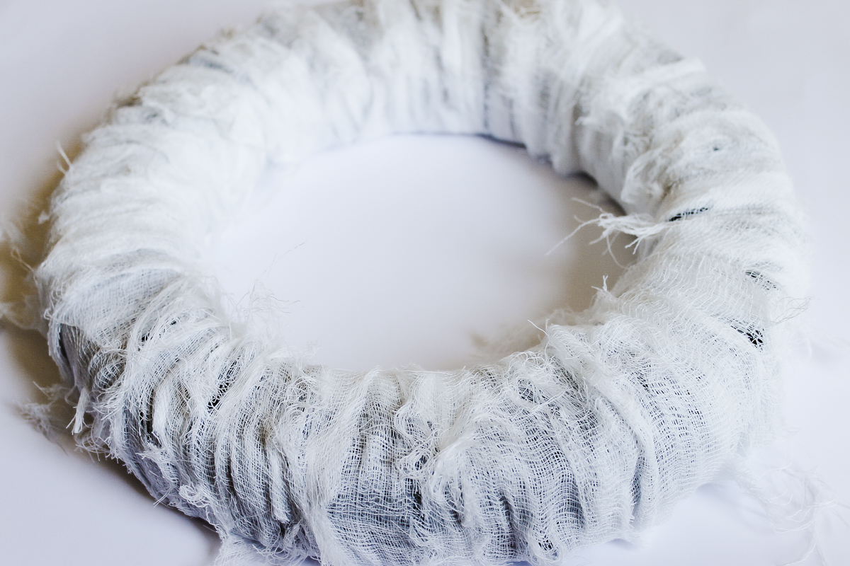 cheesecloth wrapped wreath form on a table