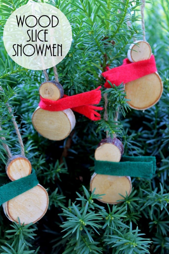 These wood slice snowmen ornaments are easy to make and perfect for your rustic farmhouse Christmas tree!