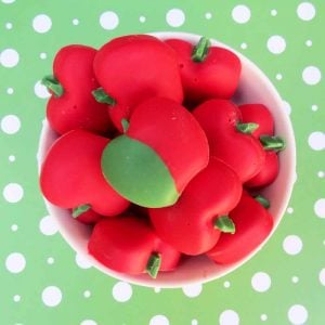 white chocolate apples on green backdrop