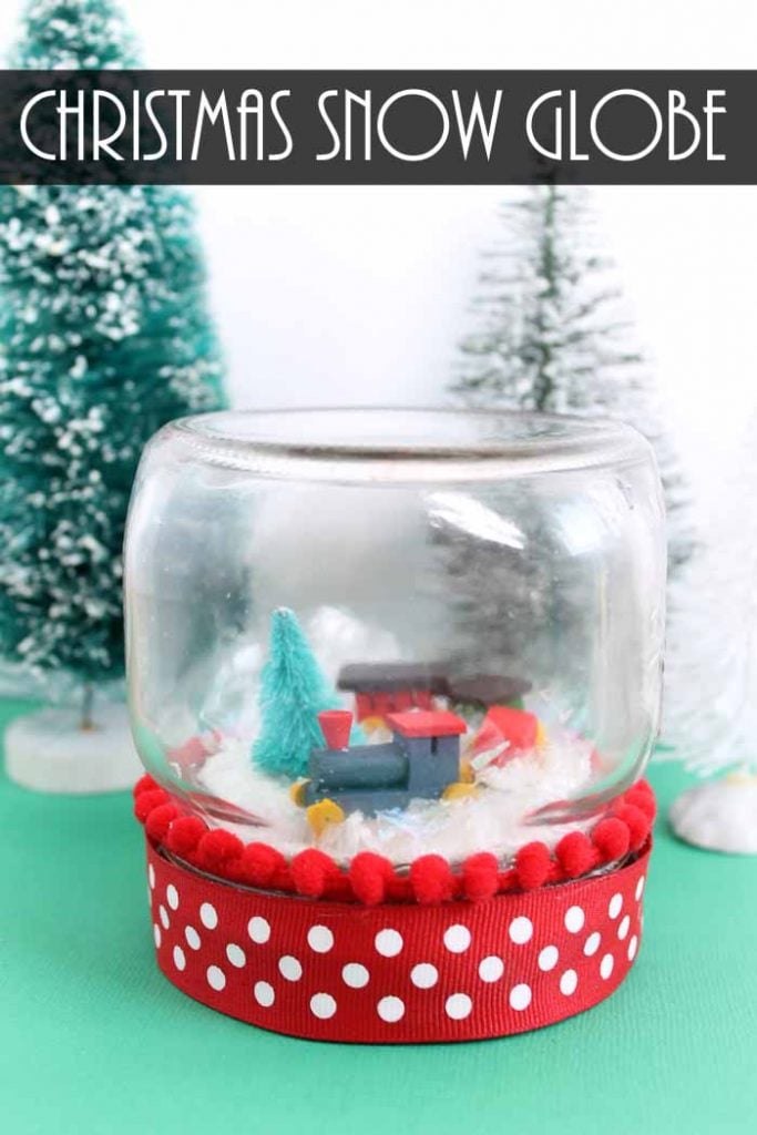 Make a Christmas snow globe in minutes with this super easy technique! Add a miniature train to a mason jar! #christmas #masonjar #snow