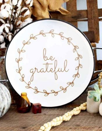 one white plate with be grateful text