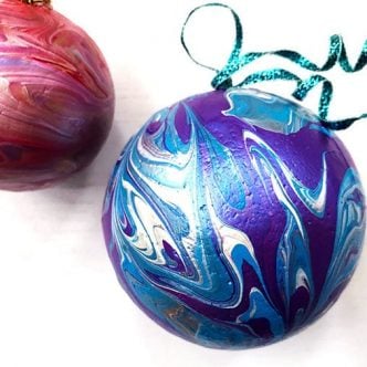 paint marbled ball ornaments on a table