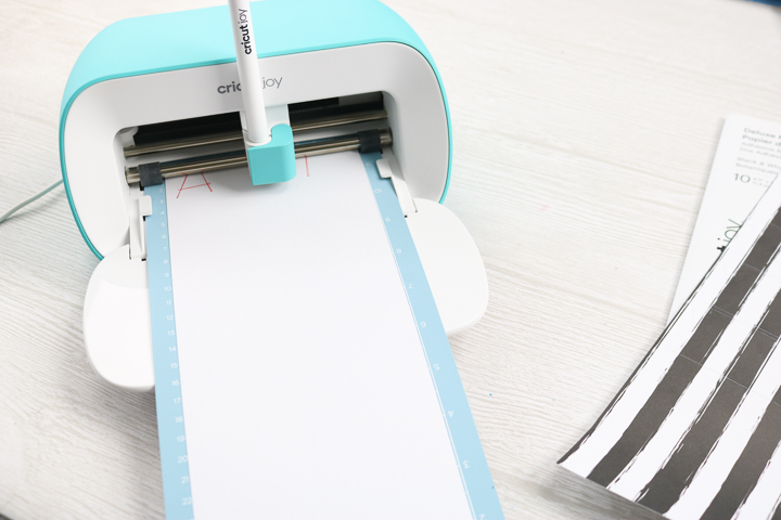 How to Cut Adhesive Backed Paper with Your Cricut - Hey, Let's