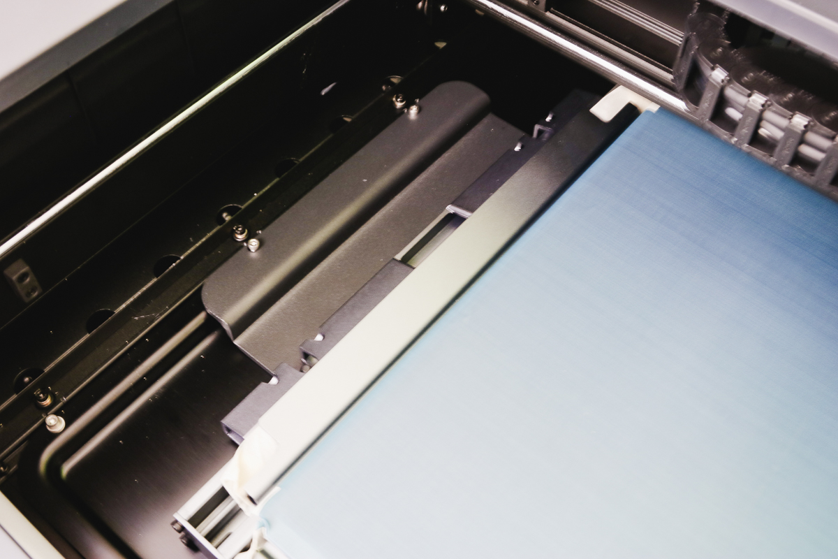Locate screen printer frame inside laser.