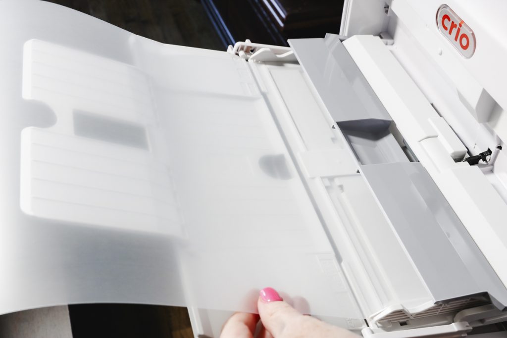 Load the forever dark paper into the white toner printer.