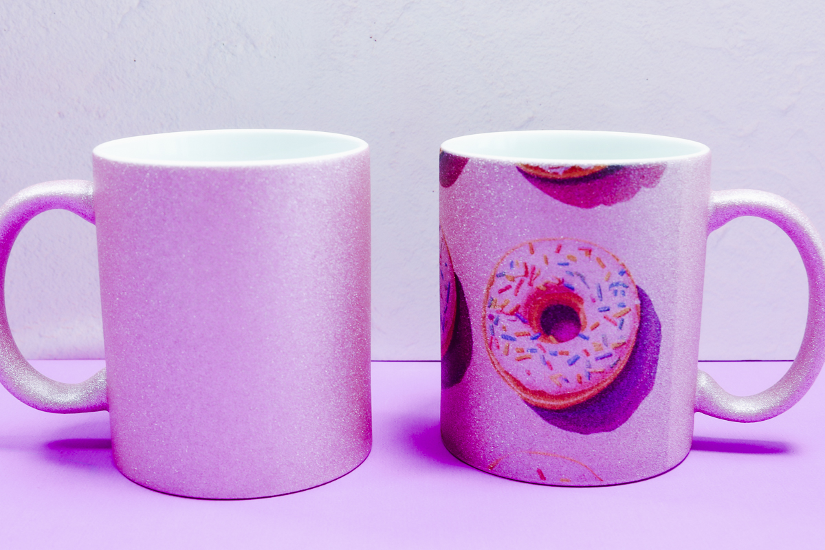 Pink glitter sublimation mug blank with design.