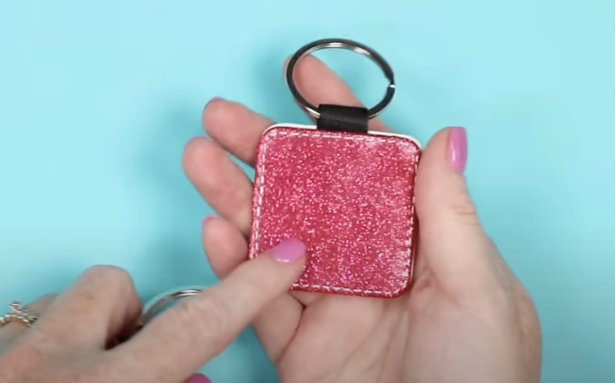 QR code keychain with glitter background.