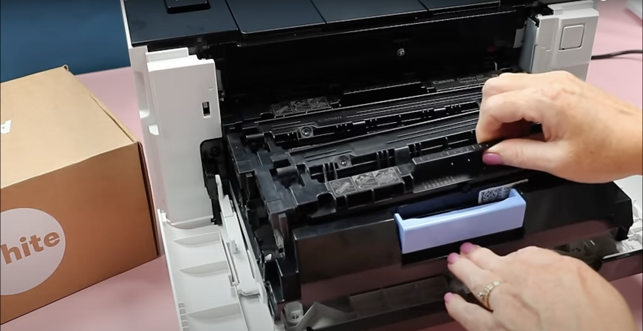 Remove the black toner cartridge and replace with the Absolute White Toner Cartridge.