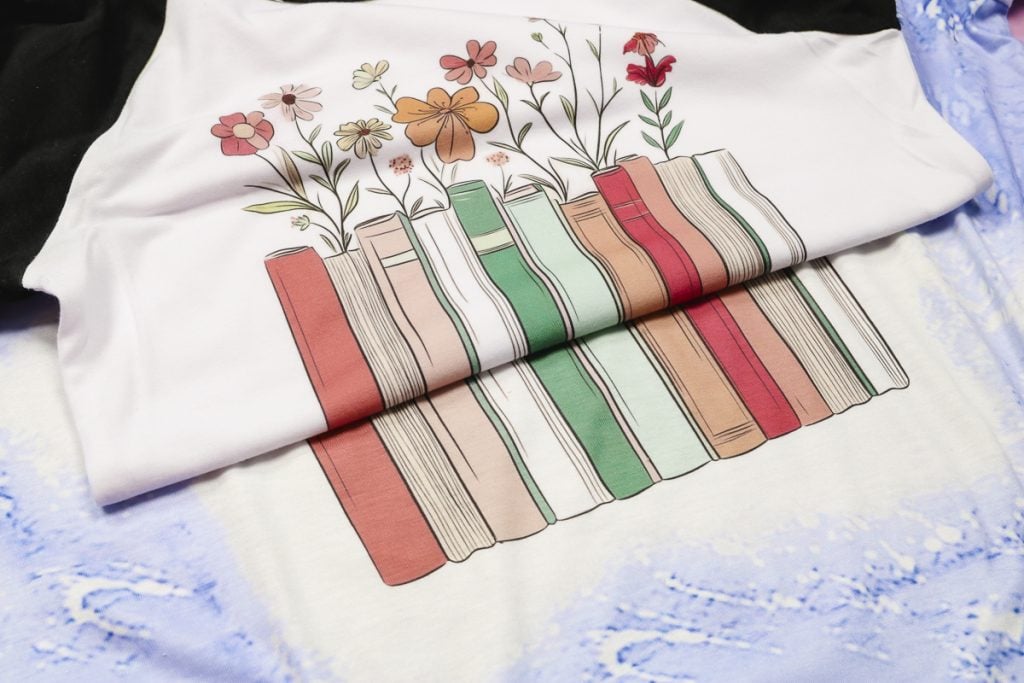 Sublimation design on bleached shirt compared to white shirt.