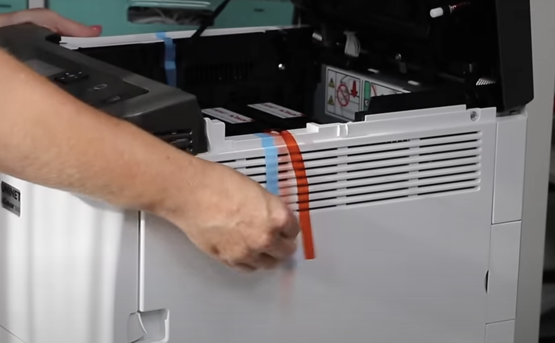 Remove packaging from IColor 560 all in one printer.