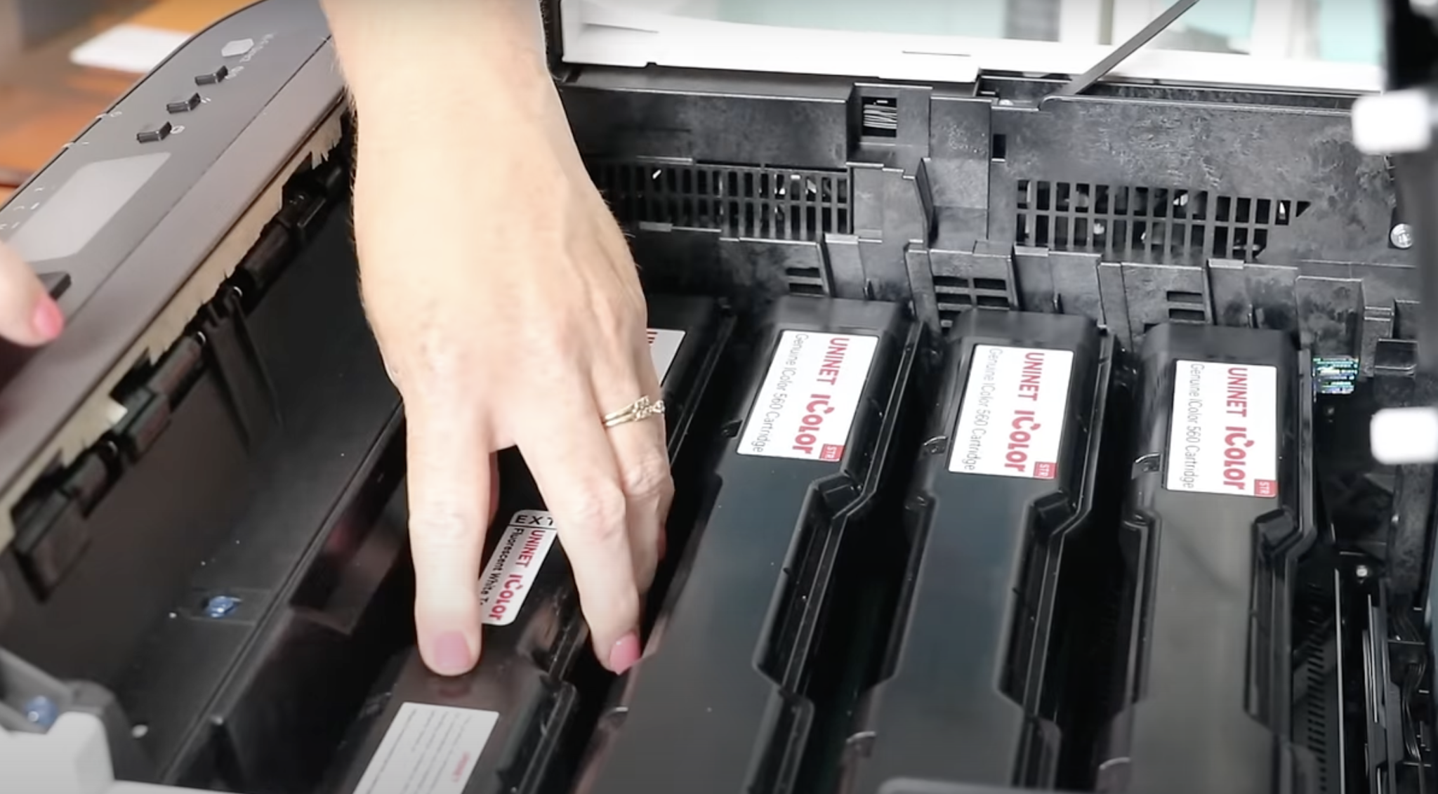 Add cartridges to the all in one printer in whatever order you need for your printing.