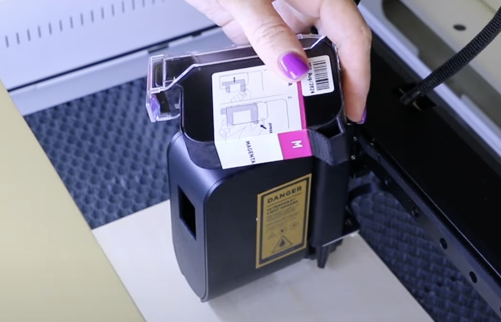 Magenta printer cartridge, shake before adding to printing module.