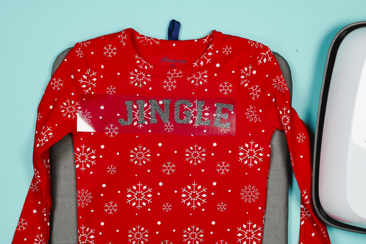 Add jingle layer of HTV on Christmas pajamas.